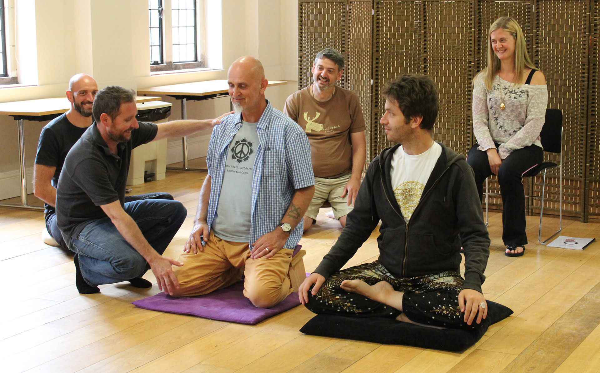 Meditation and Mindfulness Teacher Training group adjusting posture
